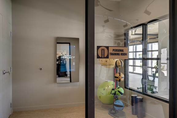 a room with a large window and a sculpture in the middle of it