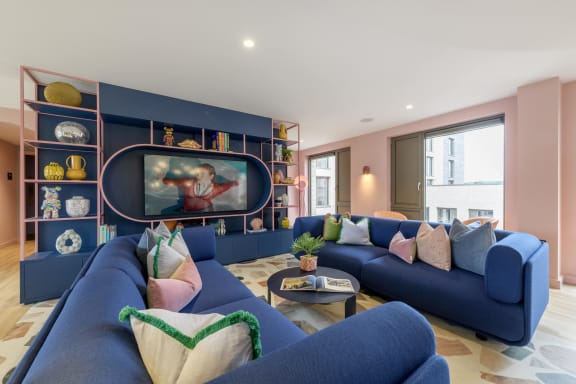 a rendering of a room with a pool table and chairs