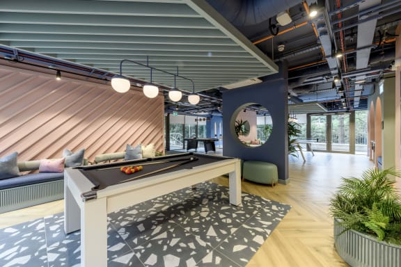 a rendering of a boxing gym with a punching bag in the middle of the room