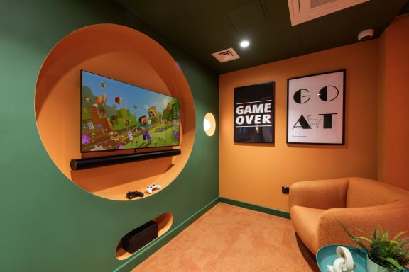 a recreation room with a ping pong table and other games