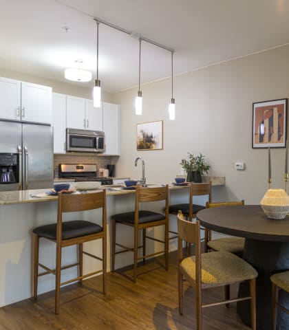 a kitchen and dining area in a 555 waverly unit  at Elmhurst 255, Elmhurst, IL, 60126
