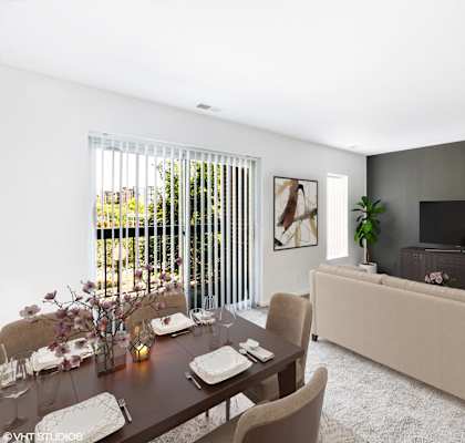 a living room with a table and a couch and a television