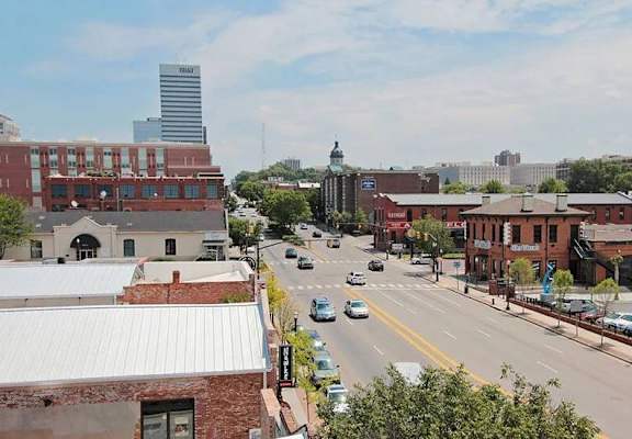 A city street with cars and buildings.