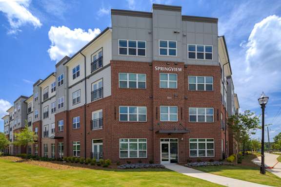 Exterior view of Springview Apartments in Decatur, GA featuring modern pet-friendly 1, 2 and 3 bedroom apartment homes near Panthersville Road.