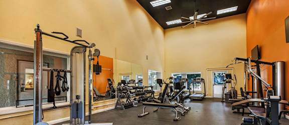 a fitness center with cardio equipment and weights  at Citrine Hills, Ontario, CA, 91761