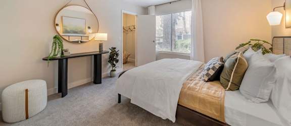 a bedroom with a bed and a window  at Citrine Hills, Ontario, CA