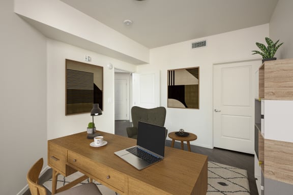 a home office with a laptop computer on a wooden desk