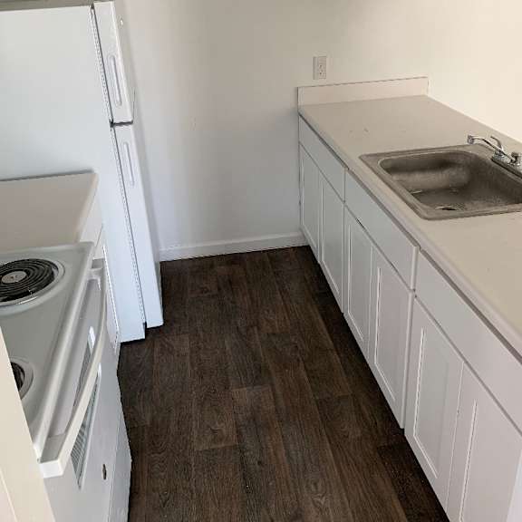 a bathroom with a sink and a toilet and a shower