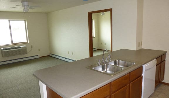 Image including sink dishwasher, window, AC