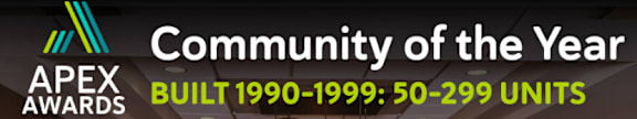 A sign that says Community of the Year and APEX Awards.
