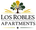 The image is a logo for Los Robles Apartments, featuring a stylized tree with green and yellow leaves.