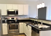 Thumbnail 4 of 16 - Granite Counter Tops, Stainless Steal appliances at Studio One Apartments, Detroit, MI, 48201