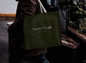 A person is carrying a tote bag at Twenty Fair Apartments, New Haven, CT