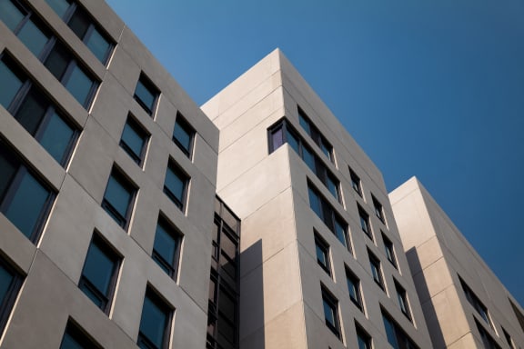 a large building with a blue sky in the background