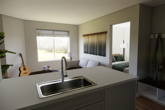 A kitchen with a sink and a window.