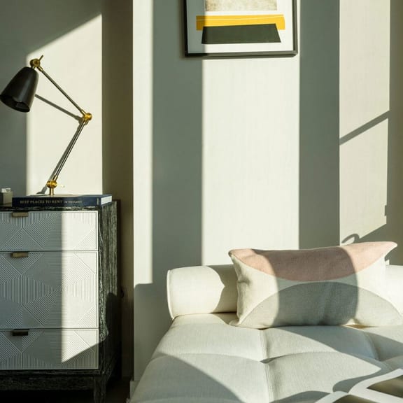a bedroom with a bed and a lamp at Altaire, Arlington