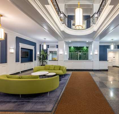 a lobby with blue and white walls and a green couch at 140 Clarendon, Massachusetts, 02116