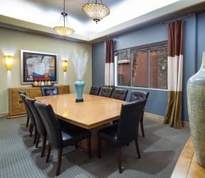 a kitchen with a large island with a marble countertop