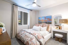 a bedroom with a bed and a window