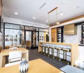 a kitchen with a large island with a marble countertop