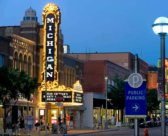 The Michigan sign is lit up at night.
