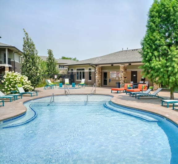 our resort style swimming pool is in front of our building with lounge chairs