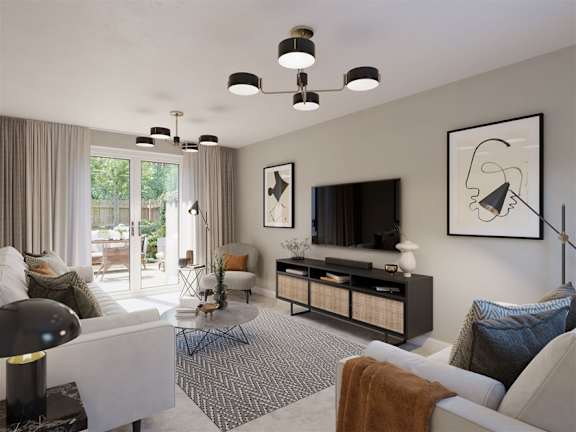 A modern living room with a white sofa, a black and white coffee table, and a television.