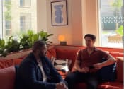Thumbnail 4 of 8 - two men sitting on a couch in a living room