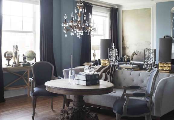 a dining room with a table and chairs and a chandelier at York House, Saint Louis