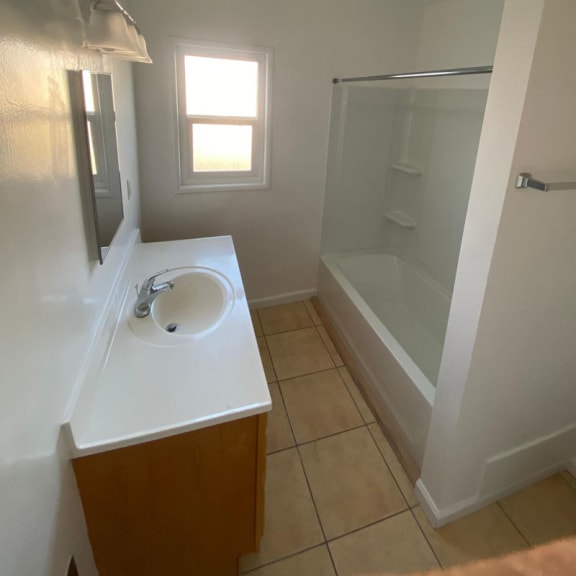 a bathroom with a sink and a bathtub