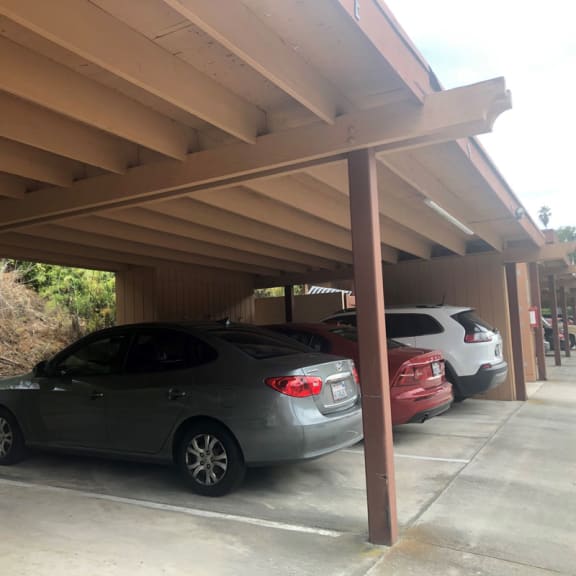 a row of cars parked in a parking lot