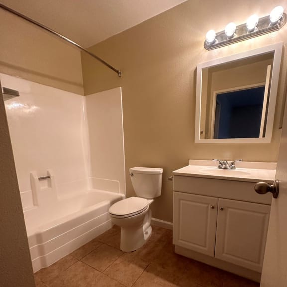 a bathroom with a toilet sink and bathtub