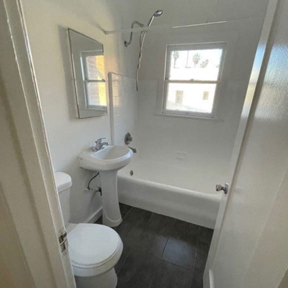 a bathroom with a sink toilet and bathtub