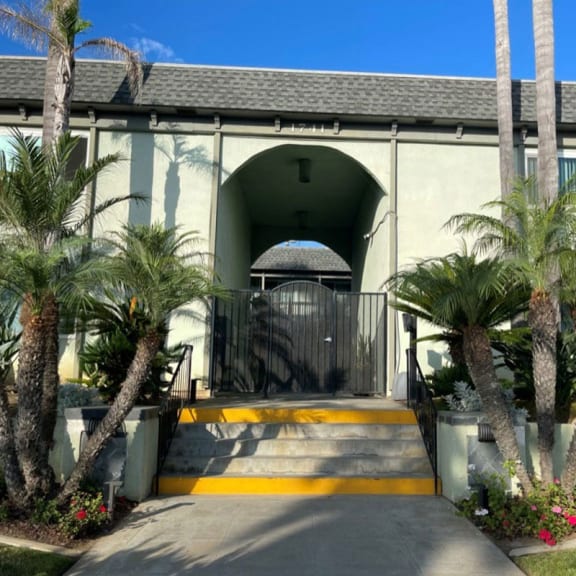 a building with palm trees in front of it