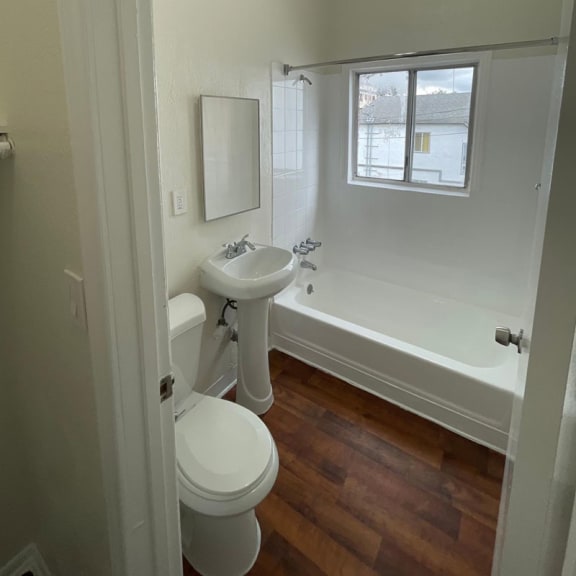 a bathroom with a toilet sink and bathtub