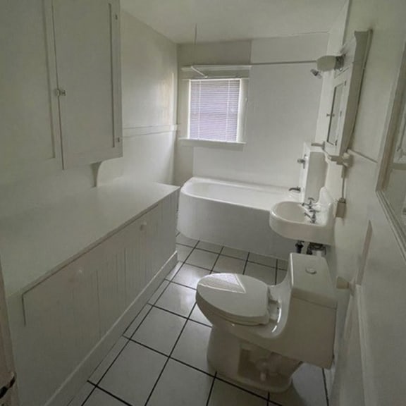 a bathroom with a toilet sink and bathtub