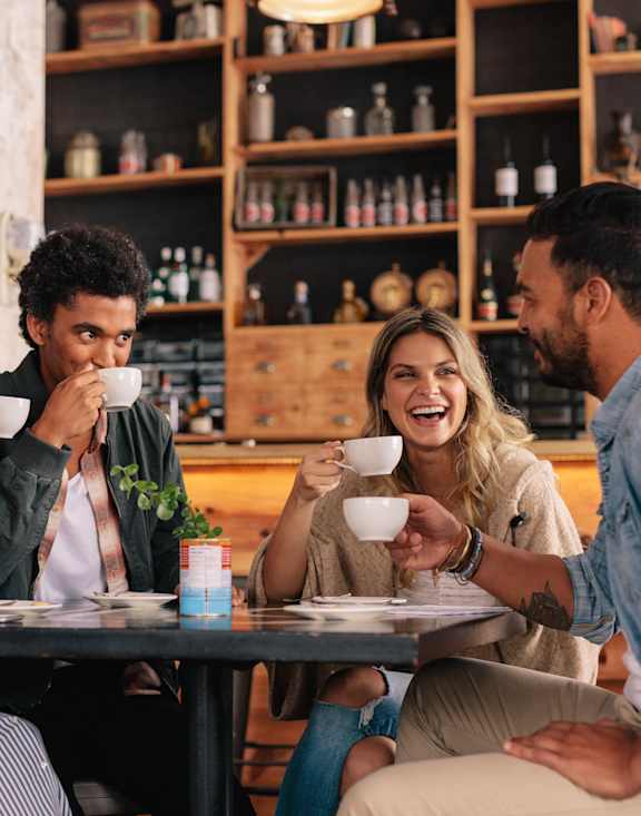 a group of people sitting at a table in a restaurant at 608 Church Apartments, Toronto, ON, M4Y 2E7