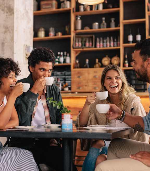 happy people drinking coffee at 177 Saint George in Toronto, CA