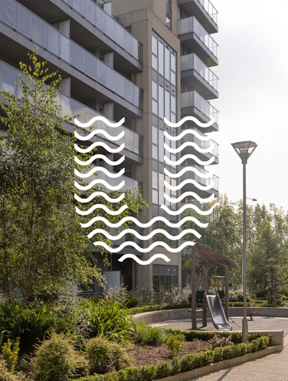 a wavy facade on a building in a park