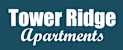 A sign that says "Tower Ridge Apartments" in white text on a blue background.