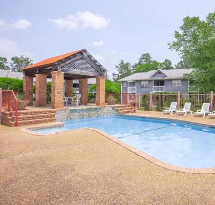 our apartments have a resort style pool with chairs and a gazebo