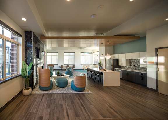 A kitchen with a refrigerator, oven, and microwave.