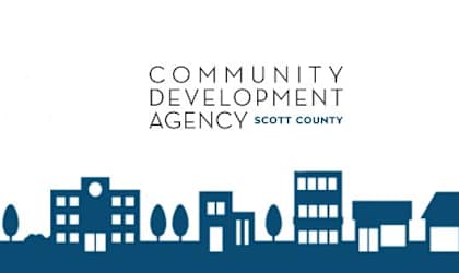 the logo for community development agency against a city skyline