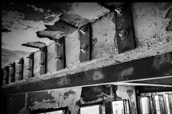 a black and white photo of a building with windows