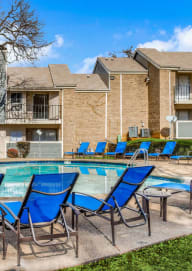 our apartments have a swimming pool and lounge chairs  at 1505 Exchange Apartments, Fort Worth, 76112