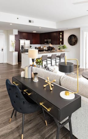 a dining room with a table and a living room
