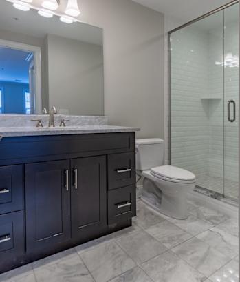 a bathroom with a toilet sink and shower at Zephyr Ridge Apartment Homes, Cedar Grove, New Jersey, 07009