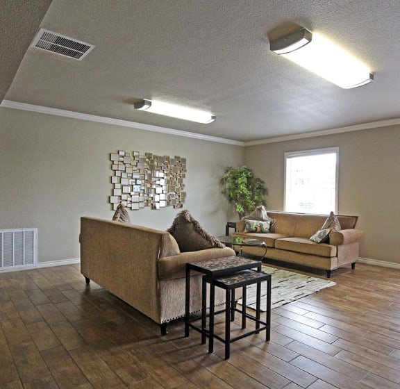 hardwood style floor living rooms at Brookside Apartments in Hewitt, TX
