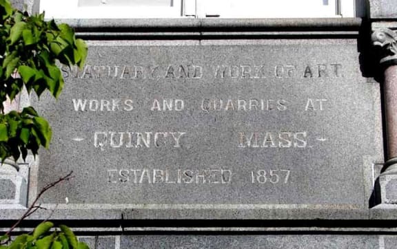 a stone inscription on the side of a building at The Granite Works Apartments , Buffalo
