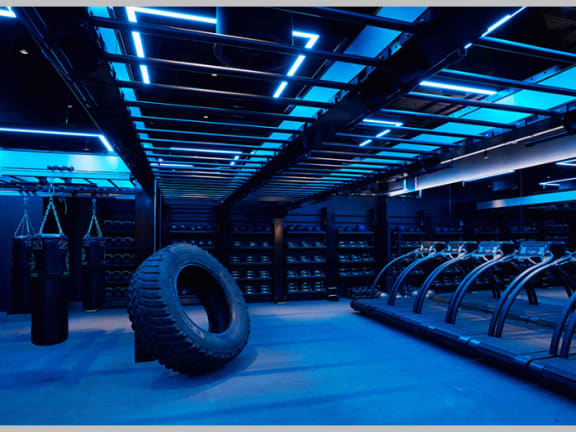 a large tire in the middle of a cyber room